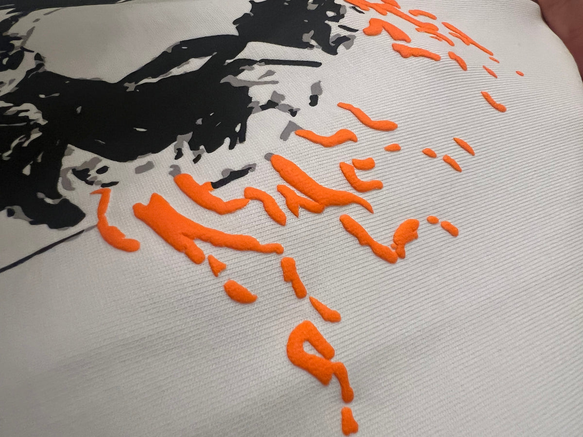 close up puff print design in orange