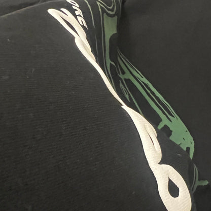 Black hoodie with a puff print graphic design on the chest