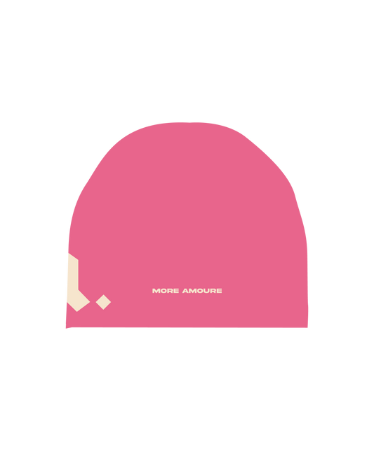 The back of the more amoure cotton beanie in pink and cream with cream embroidery of the brand name